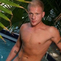 Muscular hunk is bound with chains and tormented by a security guard
